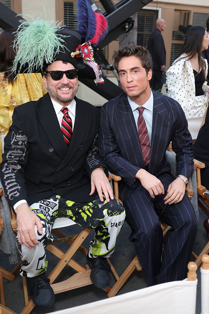 Two men seated at Vogue World Hollywood 2025 event, featuring some of the worst and weirdest celebrity looks.