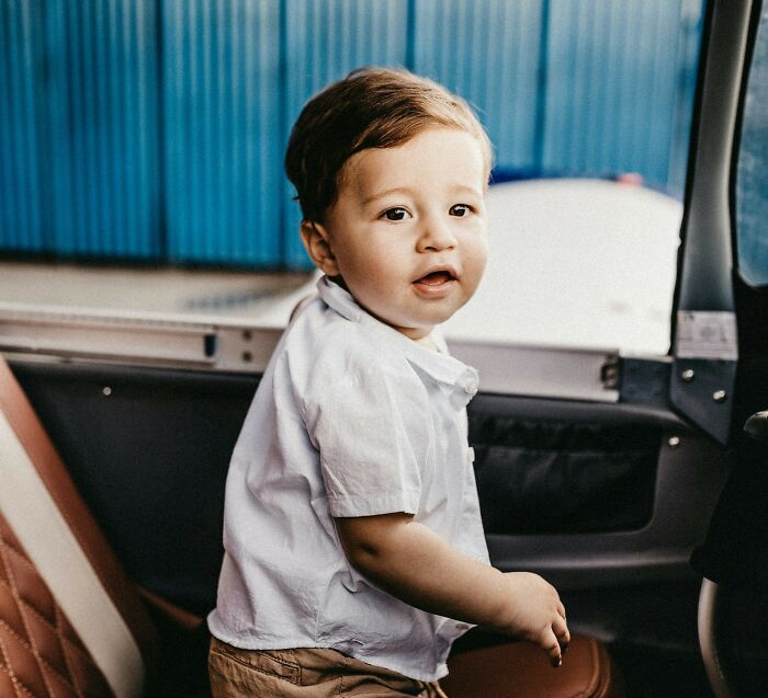 Toddler sitting inside a vehicle, representing stories of near-death experiences and how they happened in real life.