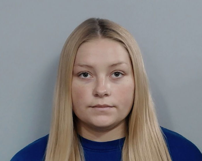 Young woman with long blonde hair and a neutral expression, related to the Laken Snelling baby case controversy.