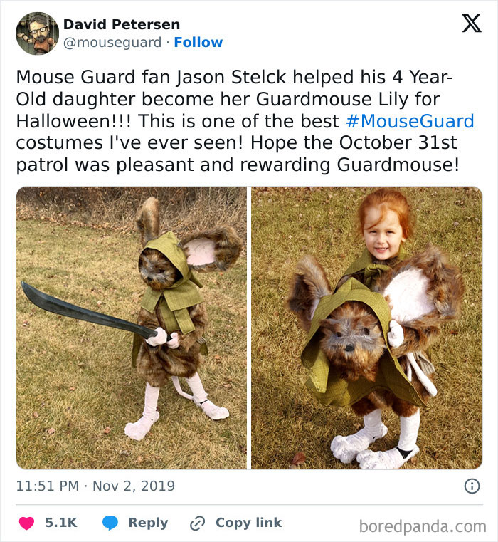 Child dressed in an amazing kids Halloween costume as a furry Guardmouse with large ears and a sword outdoors on grass.