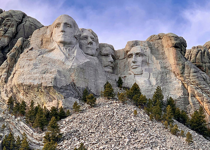 Mount Rushmore with carved faces of U.S. presidents under a clear sky, illustrating facts steak comes from cows theme.