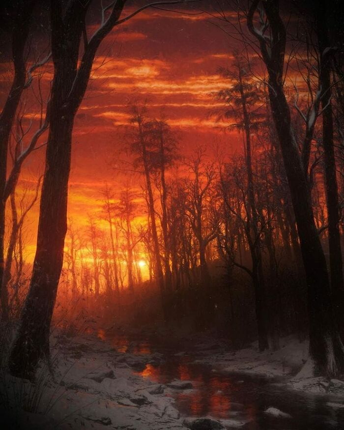 Fiery orange sunset reflecting on a small forest stream, capturing a beautiful yet unnerving liminal space at dusk.