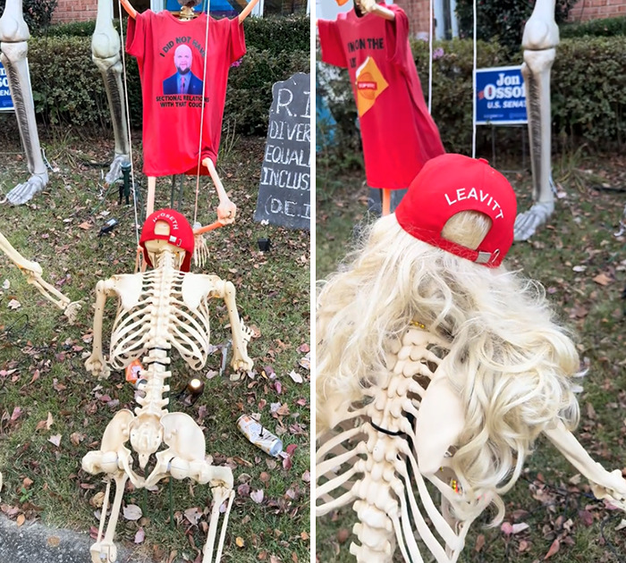 Elaborate anti-MAGA Halloween display with skeleton wearing wig and Leavitt hat, featuring humorous political details outdoors.