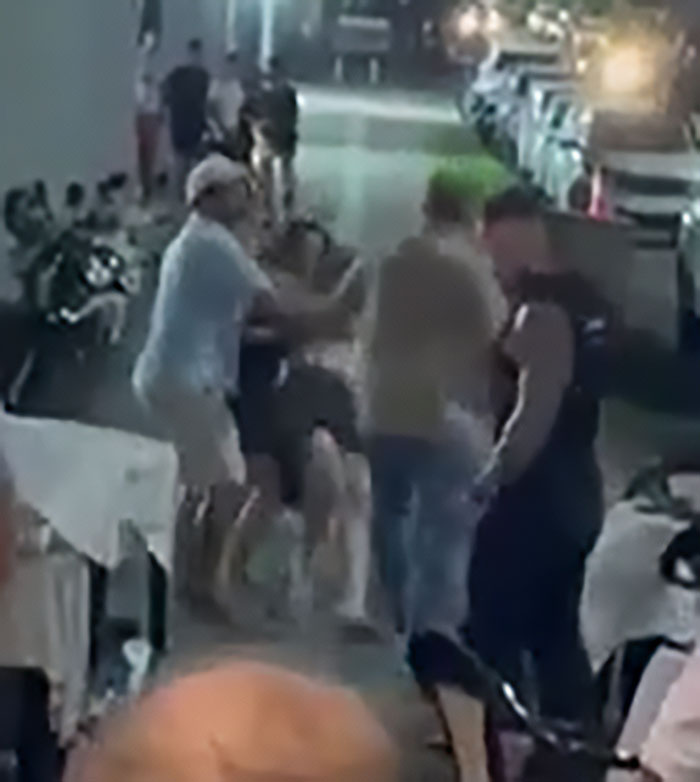 Man intervenes in street fight involving a woman and a child, sparking viral debate over children come first.
