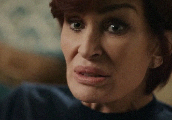 Close-up of a woman looking concerned, illustrating complex emotions for men are good positive posts online.