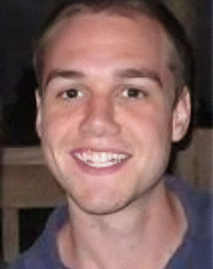 Young man smiling in a casual setting representing the mom of late Taylor Swift friend breaking her silence years after his passing.