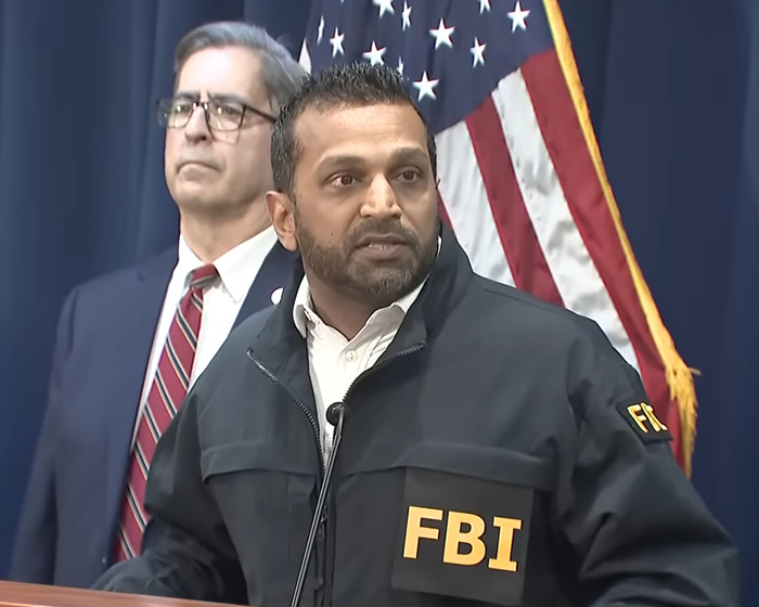 FBI agent speaking at a press conference about NBA gambling scandal involving x-ray table and special contact lenses.