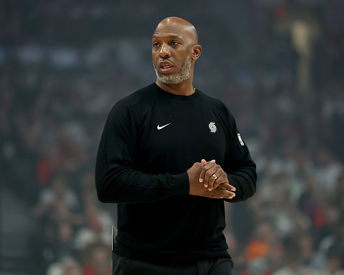 Man in black Nike sweatshirt at basketball game, relevant to NBA gambling scandal and FBI investigation details.