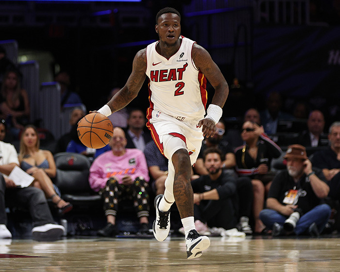 Miami Heat player dribbling during a game, illustrating NBA gambling scandal with FBI investigation details.