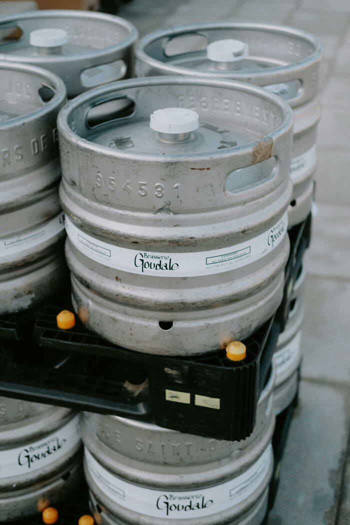 Stacked metal beer kegs outdoors, illustrating surprising answers to if these things are actually true in real life.