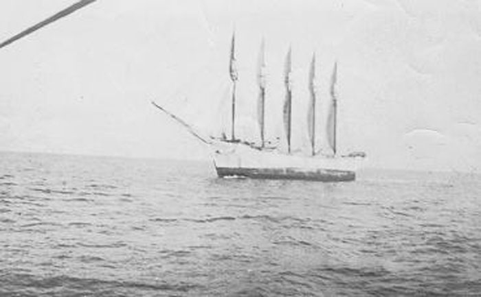 Old black and white photo of a large sailing ship with multiple masts on the ocean, showing weird and fascinating ocean history.
