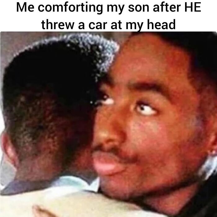 Man comforting his son after a chaotic moment, illustrating parenting love and the chaos of everyday life.