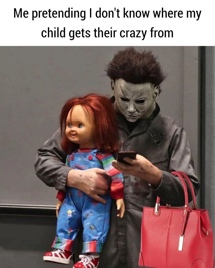 Person in Halloween costume holding a doll and a phone, humorously illustrating the chaos of parenting memes.