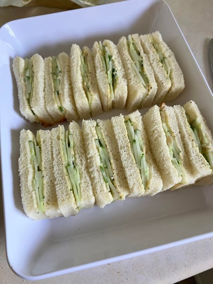 Plate of cucumber sandwiches illustrating foods not popular in their country despite tourist assumptions.