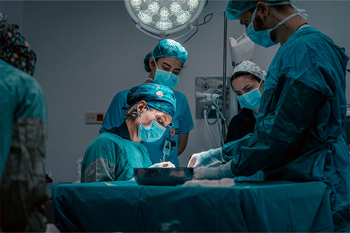 Surgical team performing operation in an operating room, highlighting stories of patients waking up during surgery.