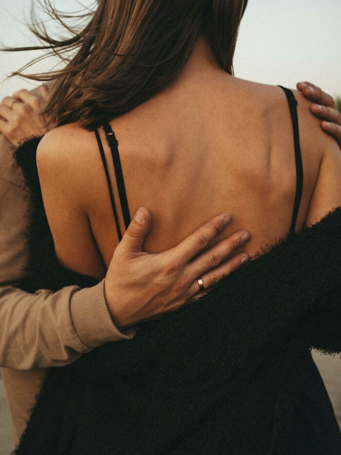 Couple embracing closely outdoors, capturing intimacy and the secrets people hide from their partners in relationships.