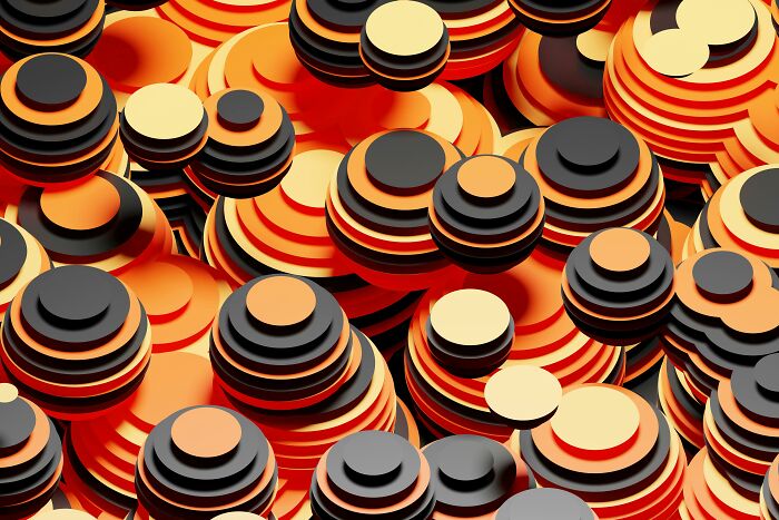 Abstract pattern with layered circular shapes in orange, black, and cream, perfect for testing pattern-spotting skills.