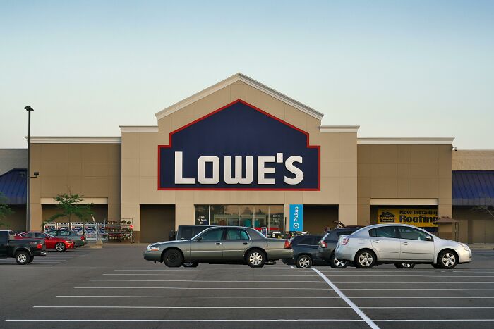 Lowe's storefront with parked cars outside, illustrating a brand often used in savage internet ex descriptions.