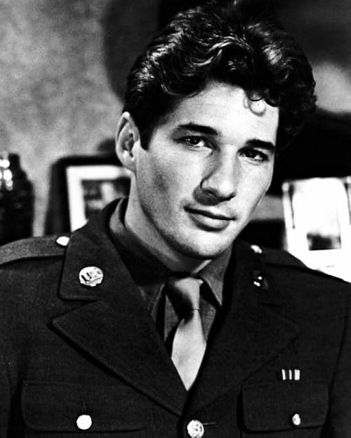 Black and white portrait of a man in military uniform, representing people who left a mark in movie and music industries.