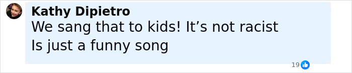 Comment from Kathy Dipietro defending a birthday song, denying racism in a discussion about a teacher accused of racism.