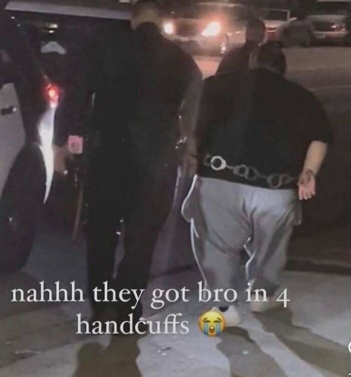 Person walking with unusual four handcuffs arrangement, depicting unhinged meme related to evil thoughts and confusion.