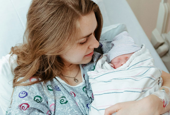 Woman taking revenge on bakery manager, celebrating with a perfectly delicious icing on the cake moment.