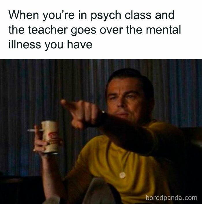 Man in a yellow shirt pointing at TV, holding a drink, illustrating psychology memes about the human mind’s quirks.