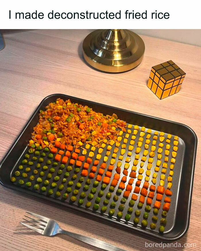 Deconstructed fried rice with peas, carrots, and corn neatly arranged on a tray, a quirky image for priest or exorcist theme.