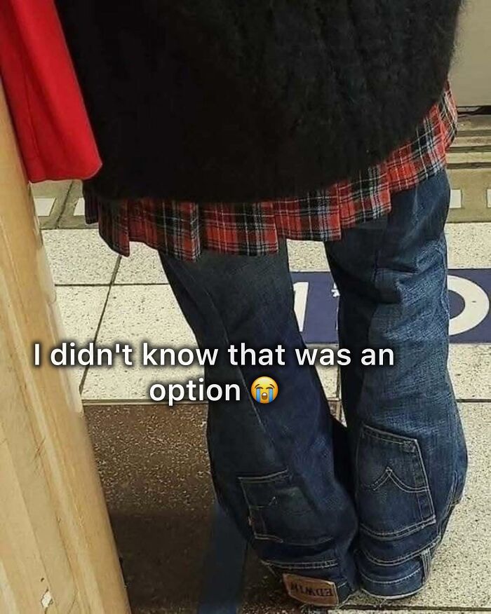 Person wearing pants with layered flannel and fur jacket standing indoors in a casual setting, illustrating pleasures of the occult.