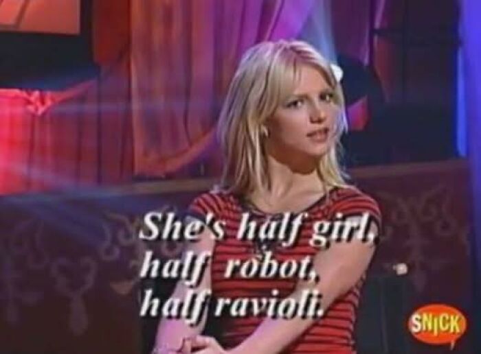 Woman in a striped shirt on a TV show with humorous text about being half girl, half robot, and half ravioli in an occult context