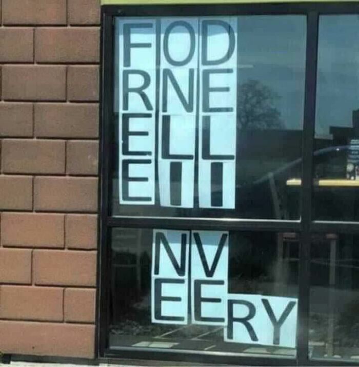 Window display with letters arranged out of order, creating a confusing and humorous occult-themed message.