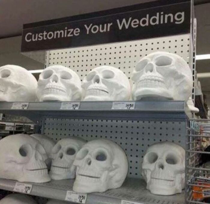 White skull decorations on store shelves under a customize your wedding sign, showing unusual occult-themed items.