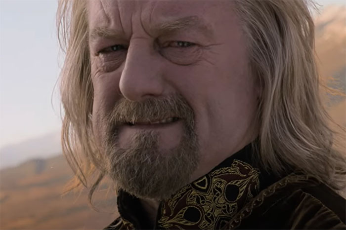 Close-up of a man with long hair and beard, showing an emotional expression that tugs at the heartstrings.