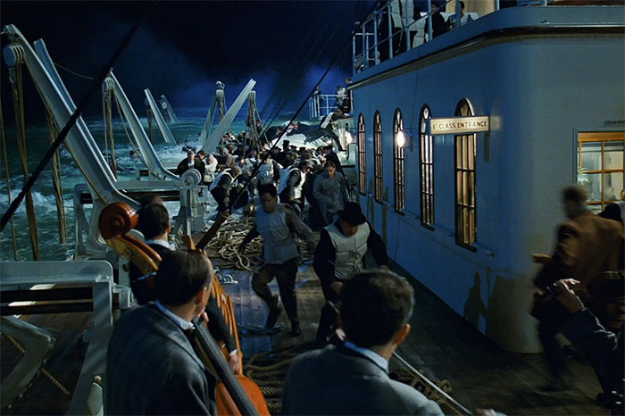 Passengers rushing on deck of a sinking ship at night, a powerful scene that tugs at the heartstrings from movies.