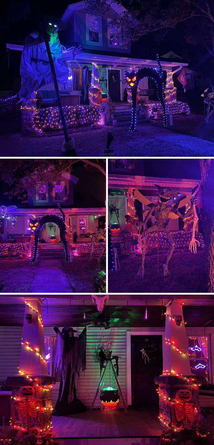 Outdoor Halloween decorations with glowing lights, spooky figures, and creative animatronics on a house porch and yard at night.