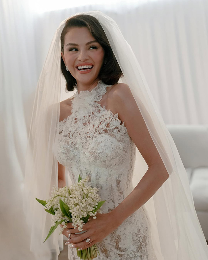 Bride in a lace wedding dress and veil holding a bouquet, relating to Selena Gomez's kidney donor wedding claims. Bride in a lace wedding dress and veil holding a bouquet, relating to Selena Gomez's kidney donor wedding claims.