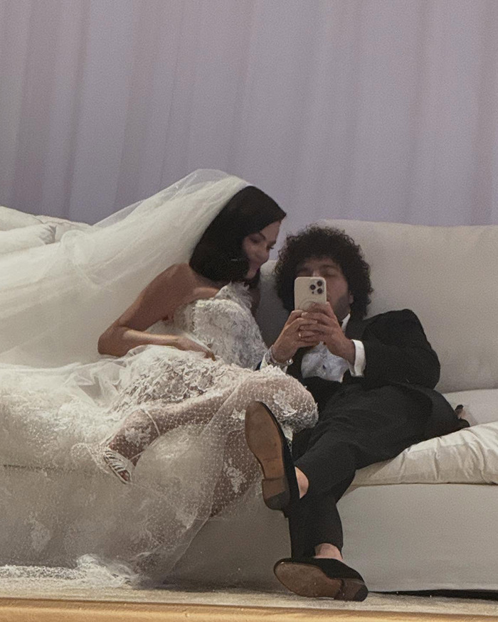 Bride and groom relaxing on a couch during wedding, highlighting Selena Gomez's kidney donor in a candid moment. Bride and groom relaxing on a couch during wedding, highlighting Selena Gomez's kidney donor in a candid moment.
