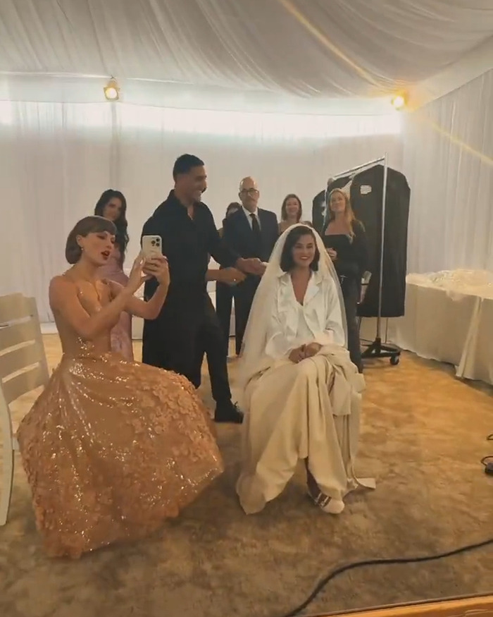 Selena Gomez at wedding with guests, highlighting controversy involving the woman who donated her a kidney.