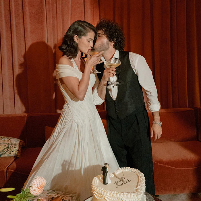 Bride and groom celebrating at wedding with cake, highlighting Selena Gomez under fire kidney donation controversy.