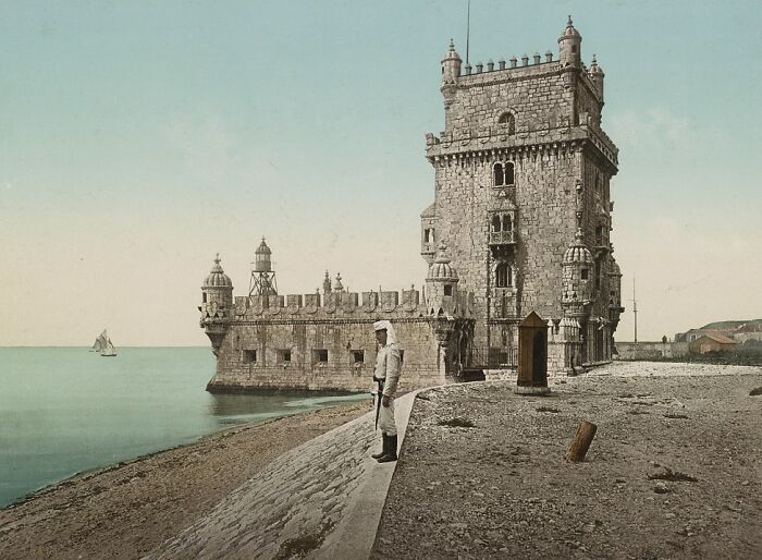 Historic view of a guarded fortress by the sea in a world capital showing what the city looked like before modern times.