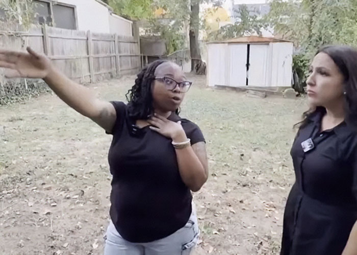 Woman gestures while explaining disturbing doorbell prank and masked trio twist to a concerned reporter outdoors.