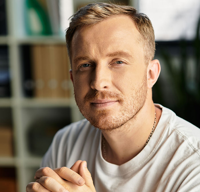 Close-up of a man with light beard and short hair, illustrating social cues that confuse people in everyday interactions.