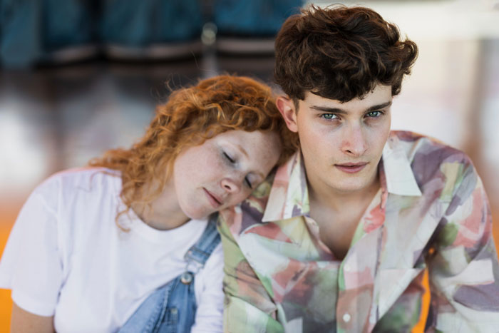 Two adult siblings showing mixed emotions, reflecting the impact of mom poisoning her kids against stepmom over the years.