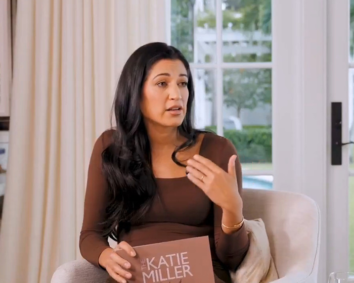 Woman with long dark hair speaking in an interview, discussing Sylvester Stallone&rsquo;s wife and trans nepo babies in Hollywood.