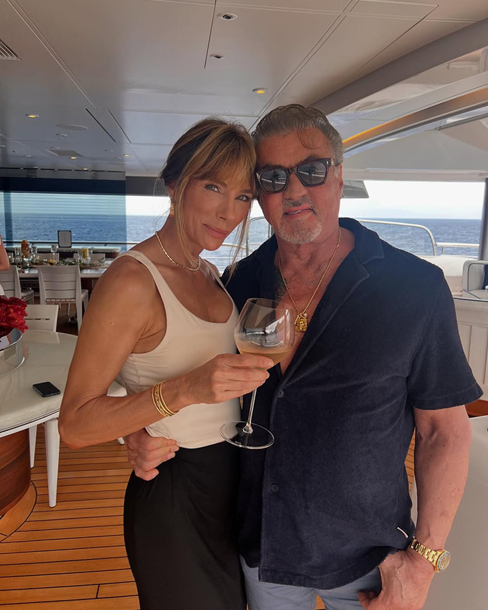 Sylvester Stallone&rsquo;s wife posing on a yacht holding a wine glass amid controversy over trans nepo babies in Hollywood.
