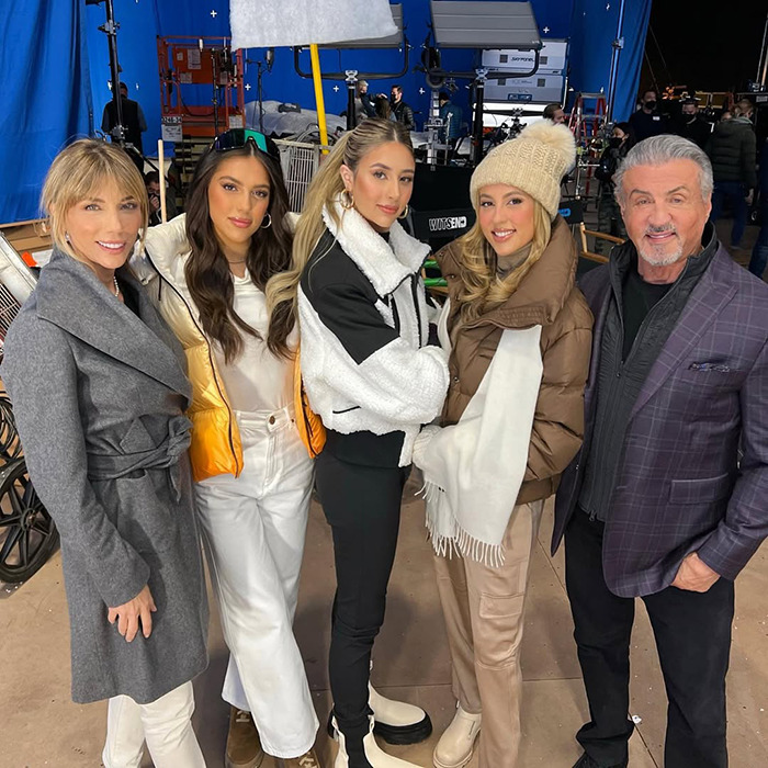 Sylvester Stallone with four women on a film set, highlighting Hollywood nepo baby discussions and related controversies.