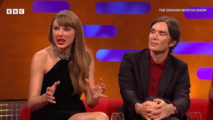 Taylor Swift speaking animatedly on the Graham Norton Show during a fan-discussed cringe moment appearance.