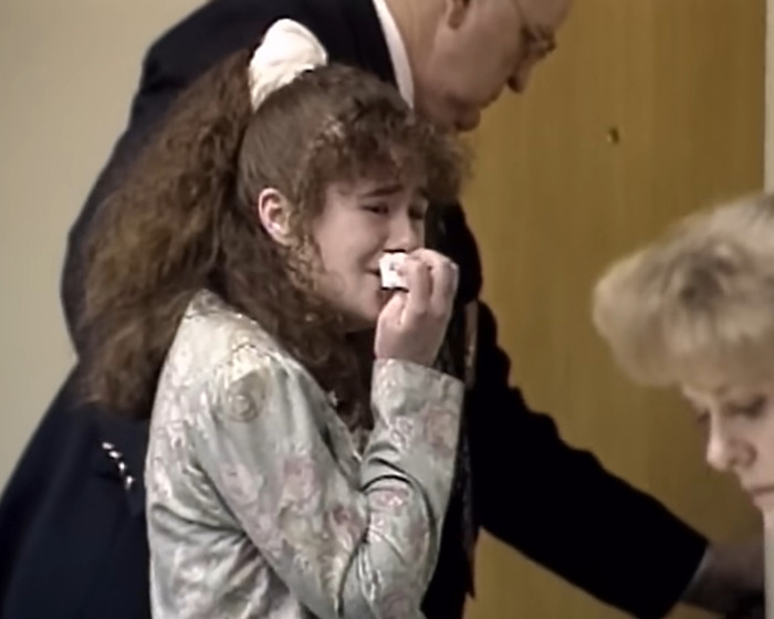 Young woman crying in court as she faces capital punishment for jealous stabbing and pentagram carving charge