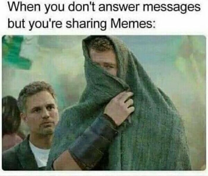 Two men with one hiding under a blanket, illustrating funny and relatable memes about sharing memes instead of answering messages.