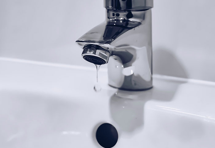 Close-up of a dripping faucet showing a rare moment people realized they aren’t supposed to see this leak in action.